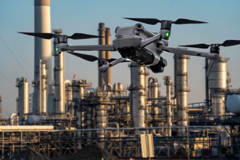 Symbolic image, photomontage, reconnaissance, spying with drones in industrial plants, critical