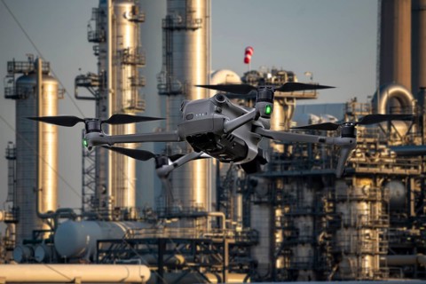 Symbolic image, photomontage, reconnaissance, spying with drones in industrial plants, critical