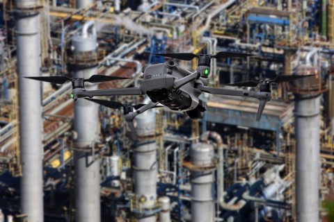 Symbolic image, photomontage, reconnaissance, spying with drones in industrial plants, critical