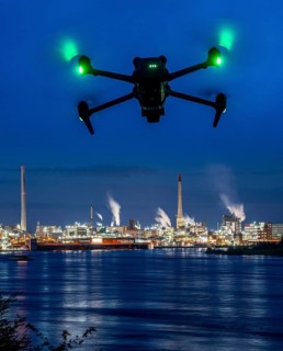 Symbolic image, photomontage, reconnaissance, spying with drones in industrial plants, critical