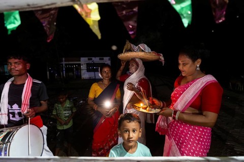 Members of the tea tribe community celebrate the vibrant Karam Festival with traditional rituals at
