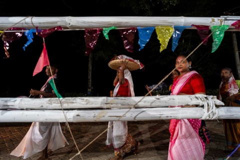 Members of the tea tribe community celebrate the vibrant Karam Festival with traditional rituals at