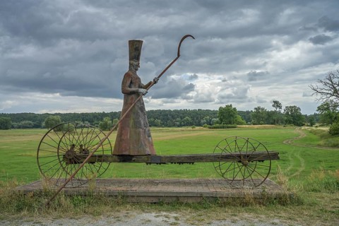 Sculpture Charon ferryman into the underworld, dyke near Mödlich, Brandenburg, Germany