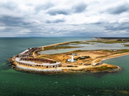 Hurst Point Lighthouse and Hurst Castle from drone over Hurst Spit, Milford on Sea, Lymington,