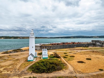 Hurst Point Lighthouse and Hurst Castle from drone over Hurst Spit, Milford on Sea, Lymington,