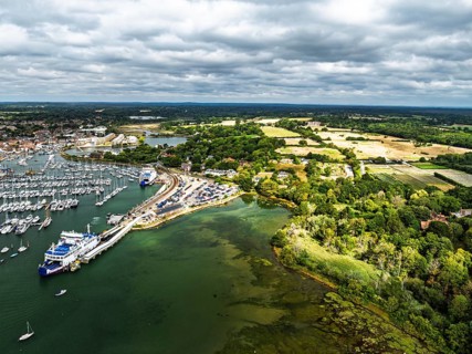 Wight Light car ferry to Isle of Wight on Lymington River and marina from drone, Lymington, New