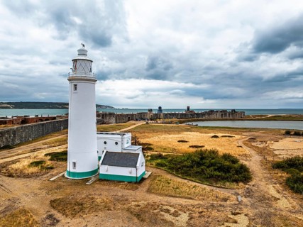 Hurst Point Lighthouse and Hurst Castle from drone over Hurst Spit, Milford on Sea, Lymington,