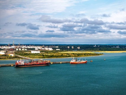 Gas tankers over refinery Esso Oil Terminal from drone, Southampton, Hampshire, England, United