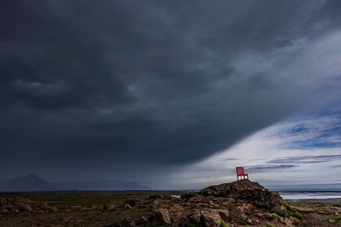Red chair, artwork, rocks, clouds, storm, rain clouds, coast, mountains, summer, Lón, south-east