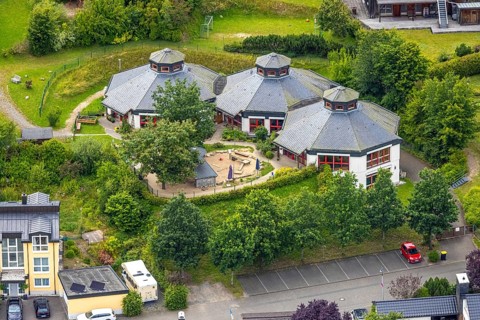 Aerial view, AWO Family Centre Laubfrosch Kindergarten, octagonal building and playground, Bad