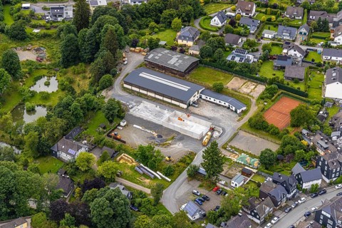 Aerial view, horse farm and riding stable, construction site with new building, tennis courts,