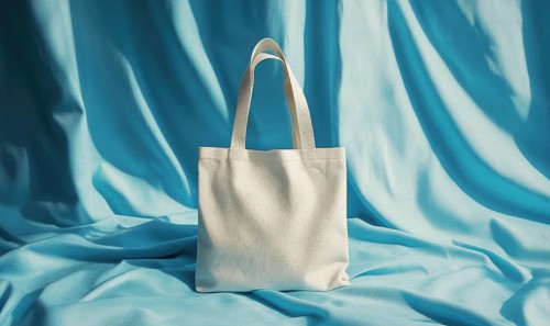 A white purse is on a blue background. The purse is the main focus of the image. The blue