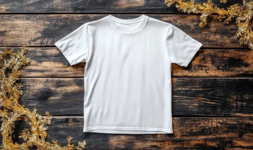 A white t-shirt is displayed on a wooden table. The shirt is unbuttoned and has no design or