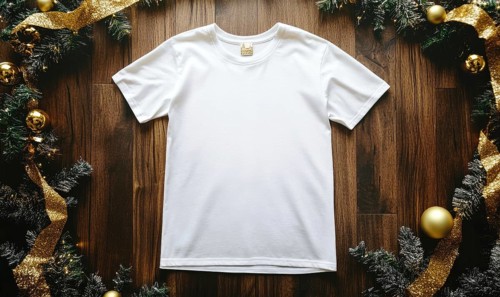A white t-shirt is displayed on a wooden surface with a gold ribbon around it. Concept of