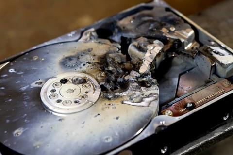 Detail shot of a massive destroyed hard disk drive