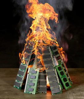 Burning pile of random access memory sticks in front of dark back