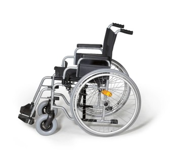 Studio photography of a empty wheelchair in white back with shadow