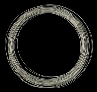 Studio photography of rolled silver wire in black back