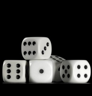 Surface angle closeup studio photography of some dice in dark back