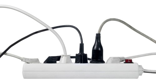 Studio photography of a multiple socket and connected plugs isolated on white with clipping path