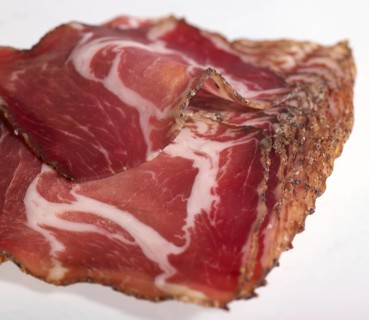 Closeup shot showing sliced raw ham pieces