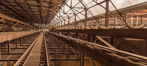 Weathered rusty industrial scenery with old rundown, steel girders and appliances