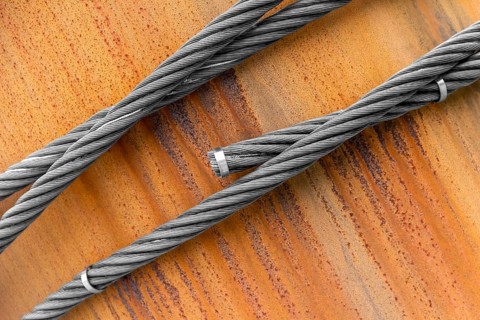 Closeup shot of wire ropes on rusty ground