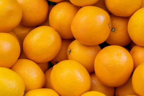 Full frame shot showing lots of fresh orange lemon fruits