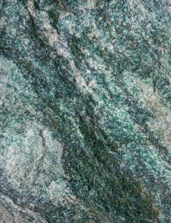 Full frame abstract marbled greenish mineral structure