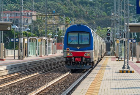 Railway station with train in Imperia, a city in Liguria, northern Italy