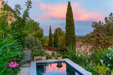 Idyllic scenery including a small swimming pool seen in Beaumes-de-Venise, a commune in the