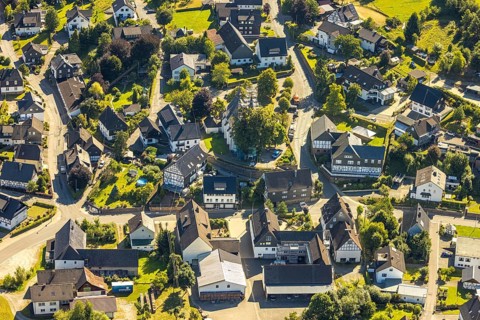 Aerial view, construction site and construction work with scaffolding at the heritage-protected