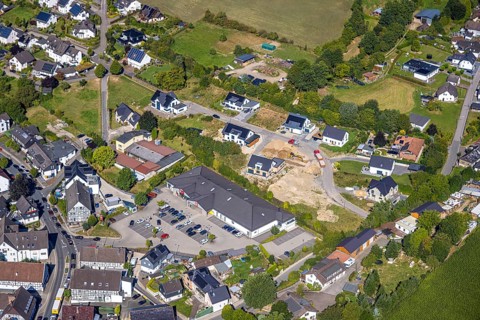 Aerial view, construction site with new construction residential area single-family houses