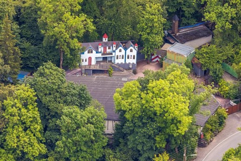 Aerial view, open air stage covered by trees and outbuildings with towers, Herdringen, Arnsberg,
