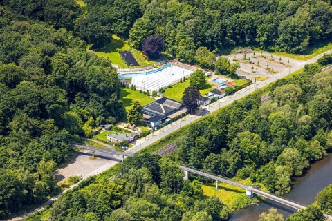 Aerial view, outdoor swimming pool Neheim, swimming pool without water, in the forest area at the