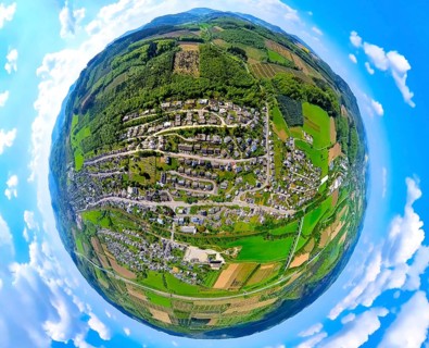 Aerial view, residential area local view Velmede, forest area with tree plantations, globe, fisheye