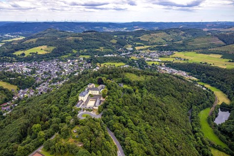 Aerial view, Wittgenstein Castle, view over Bad Laasphe with hilly landscape and distant view,