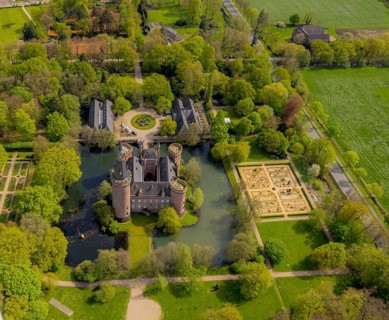 Aerial view, Museum Schloss Moyland, neo-Gothic moated castle and castle park surrounded by meadows