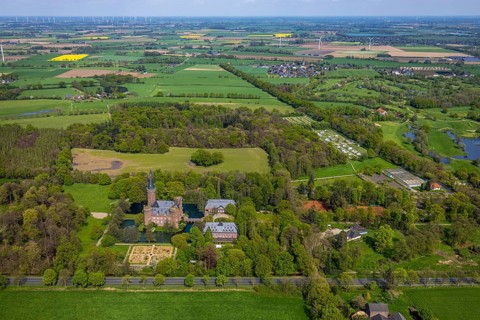 Aerial view, Museum Schloss Moyland, neo-Gothic moated castle and castle park surrounded by meadows