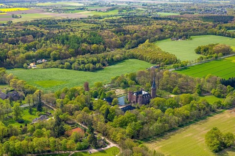 Aerial view, Museum Schloss Moyland, neo-Gothic moated castle and castle park surrounded by meadows