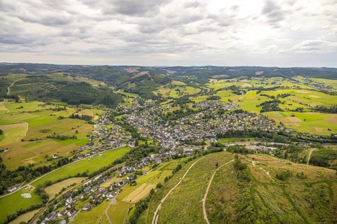 Aerial view, view of Feudingen residential area, hilly landscape with meadows and fields and