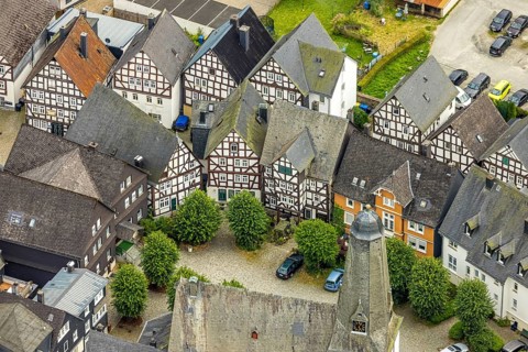 Aerial view, spire of the protestant town church and church square in the town centre with historic