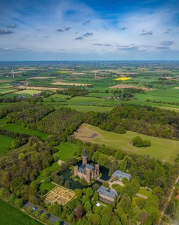 Aerial view, Museum Schloss Moyland, neo-Gothic moated castle and castle park surrounded by meadows