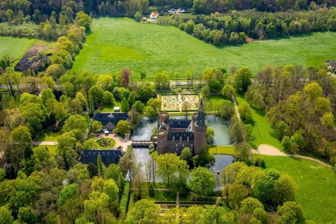 Aerial view, Museum Schloss Moyland, neo-Gothic moated castle and castle park surrounded by meadows