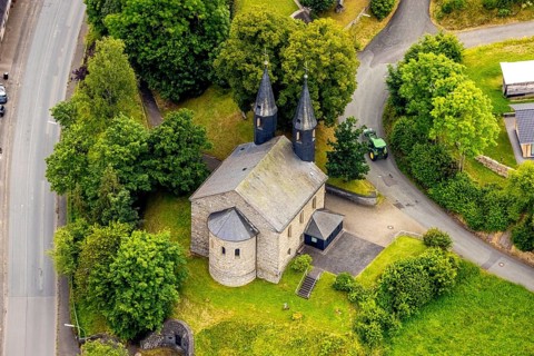 Aerial view, Banfe church in the village centre, green trees and tractor, Banfe, Bad Laasphe,