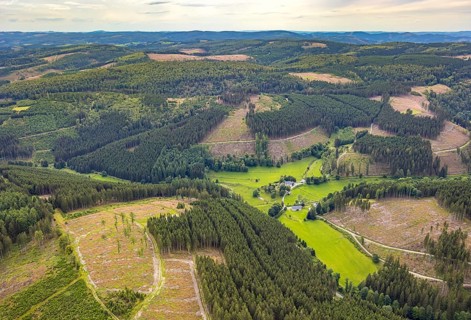 Aerial view, Homrighausen forester's lodge, half-timbered house in picturesque hilly landscape with