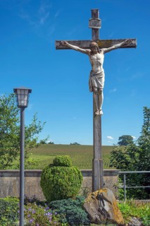 Crucifix and lantern at the Roman Catholic parish church of the Assumption of the Virgin Mary in