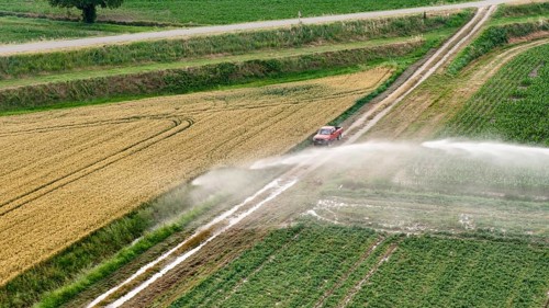 Agricultural irrigation using a rain gun sprinkler system for soybean cultivation in the Po Valley