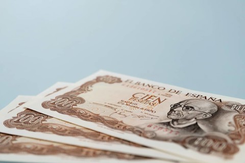 Stack of old one hundred pesetas banknotes issued by bank of spain in 1970 featuring the portrait