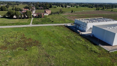 Modern industrial facility development in the Italian countryside showcasing infrastructure growth
